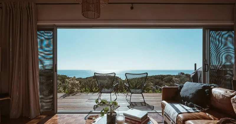 College dorm room with moving boxes and backpack