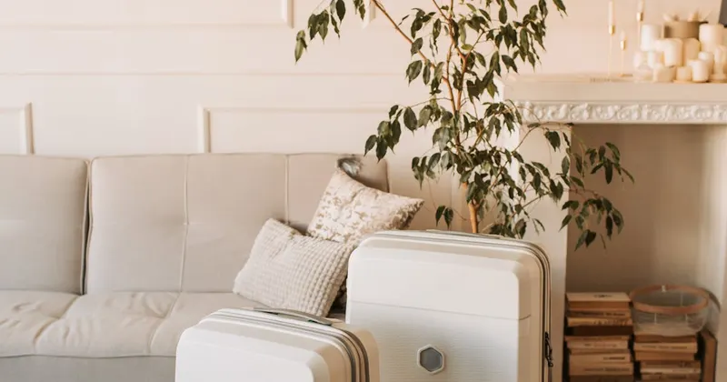 Packed suitcase standing in a living room ready for summer vacation