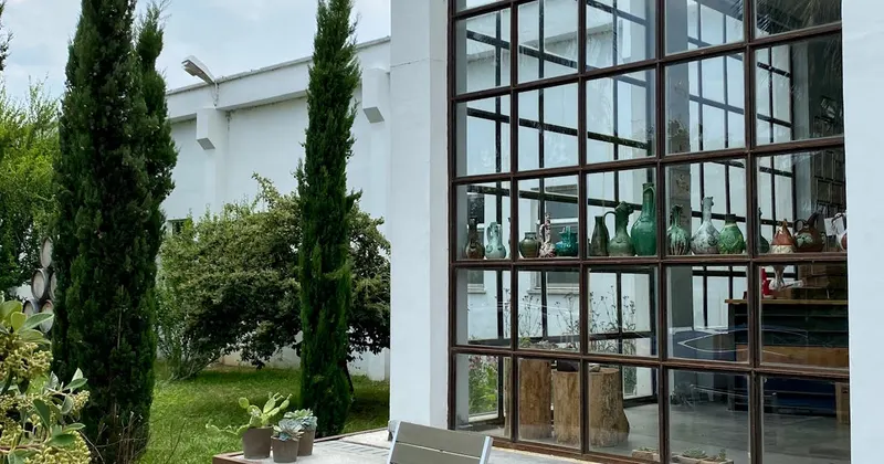 Wooden chairs and table on a clean modern outdoor patio