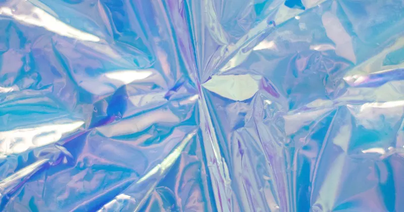 Close-up of crinkled aluminum foil with reflective surface