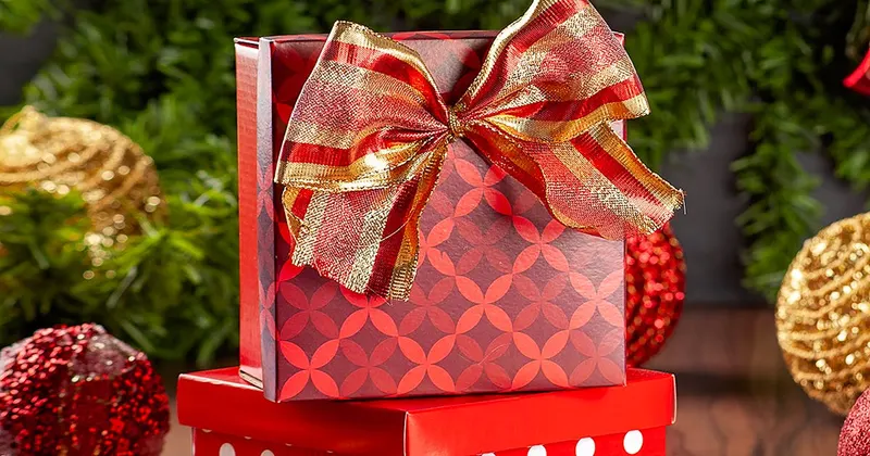 Festive Christmas gift boxes with ornaments and decorations