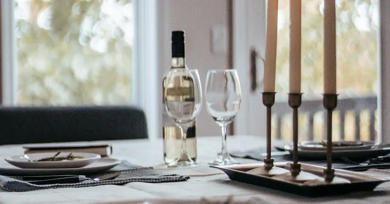 Elegantly served table with dishware and candles for dinner