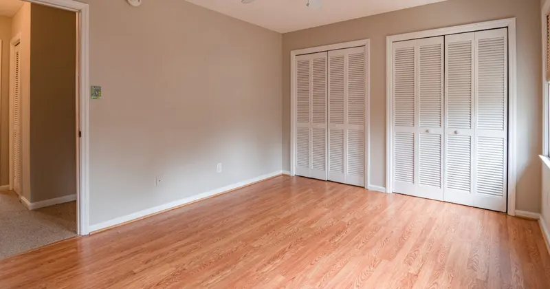 White ceiling fan turned off in a bright room