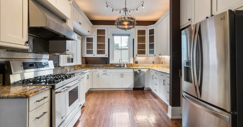 Appliances and fixtures in a home kitchen with wood flooring
