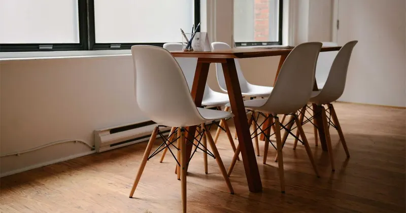 Coworking space with clean communal desks and chairs