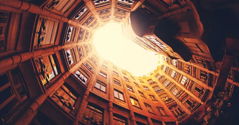 Cardboard moving boxes stacked in an empty apartment room