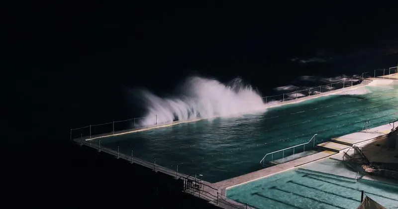 Person mopping a bright hardwood floor